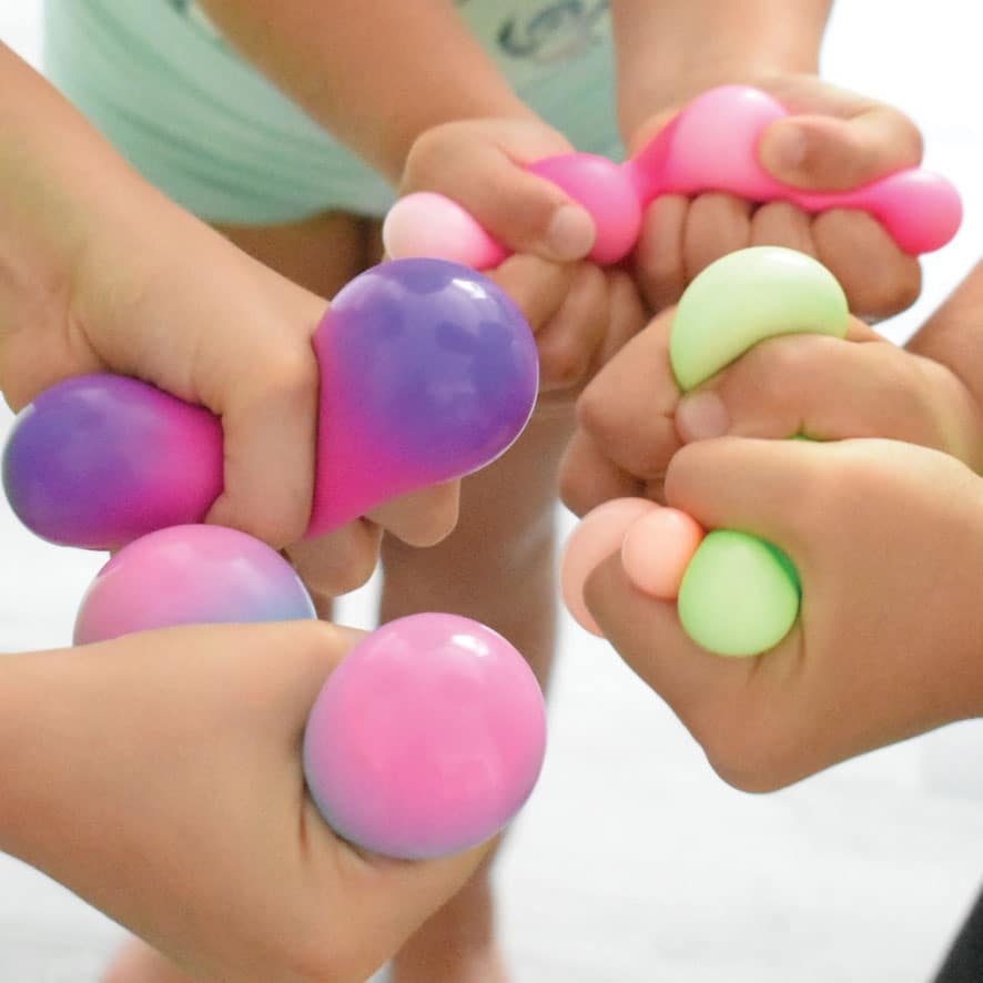 Friends squeezing NeeDoh globs together